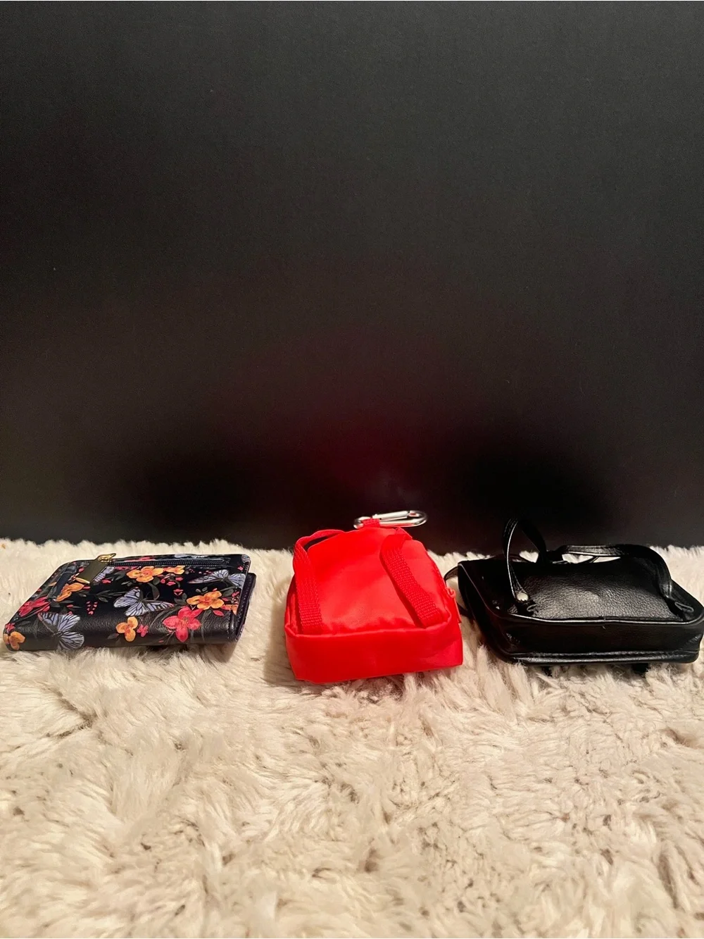 Three piece bundle of two coin, purses, and one small wallet